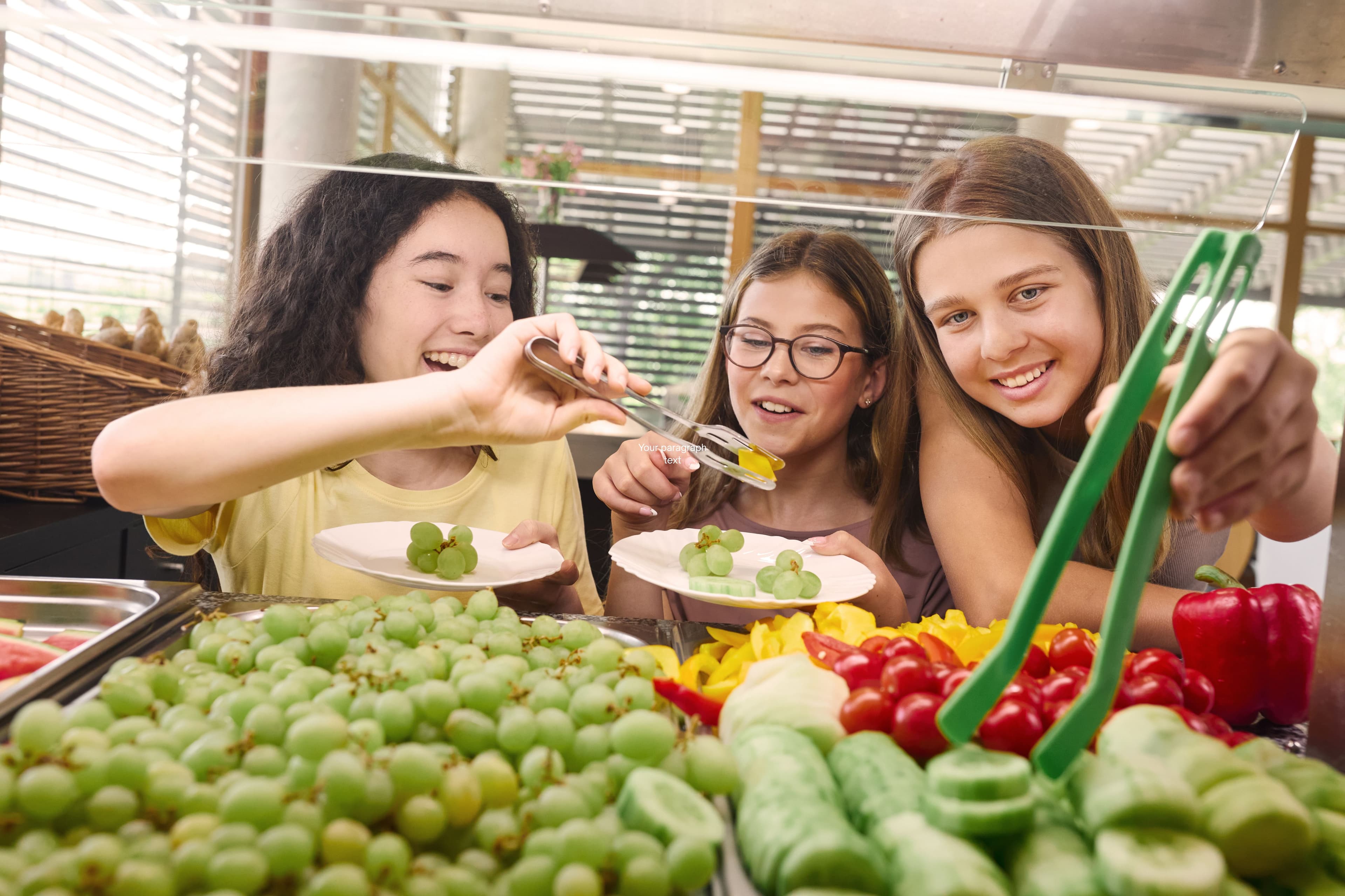 Students choosing fresh fruits and vegetables at a school cafeteria