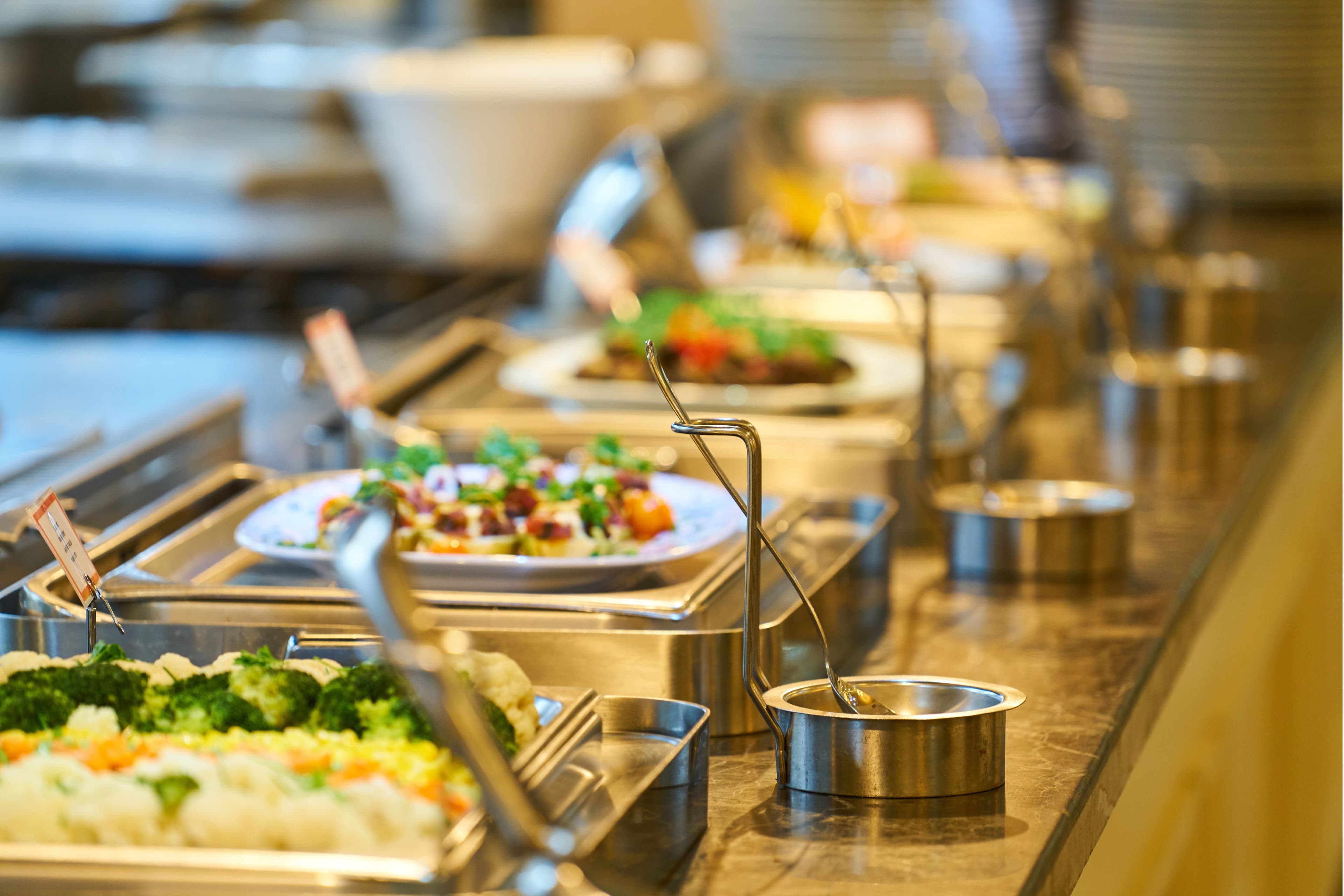 Cafeteria serving line with prepared dishes